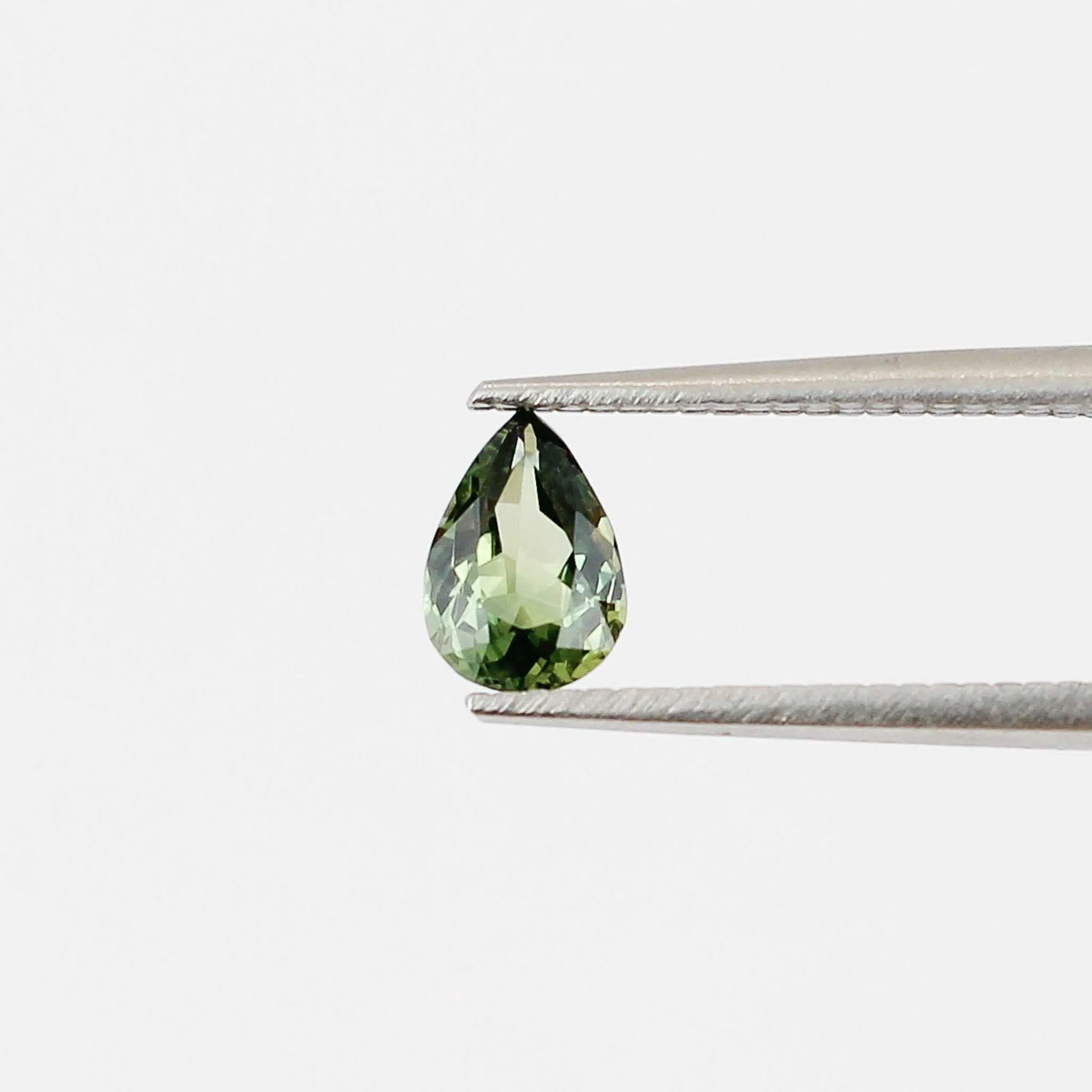 0.82 carat pear-shaped green sapphire