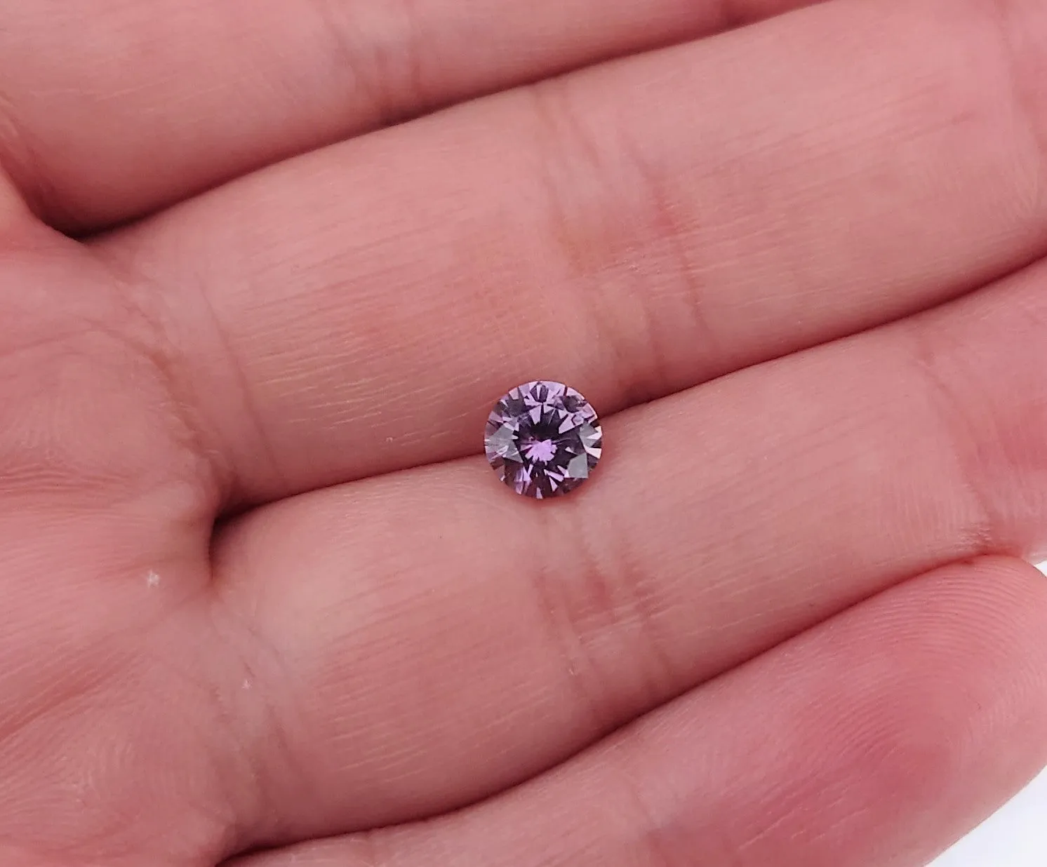 1.28 carat pink purple round Montana sapphire - Shop Now.