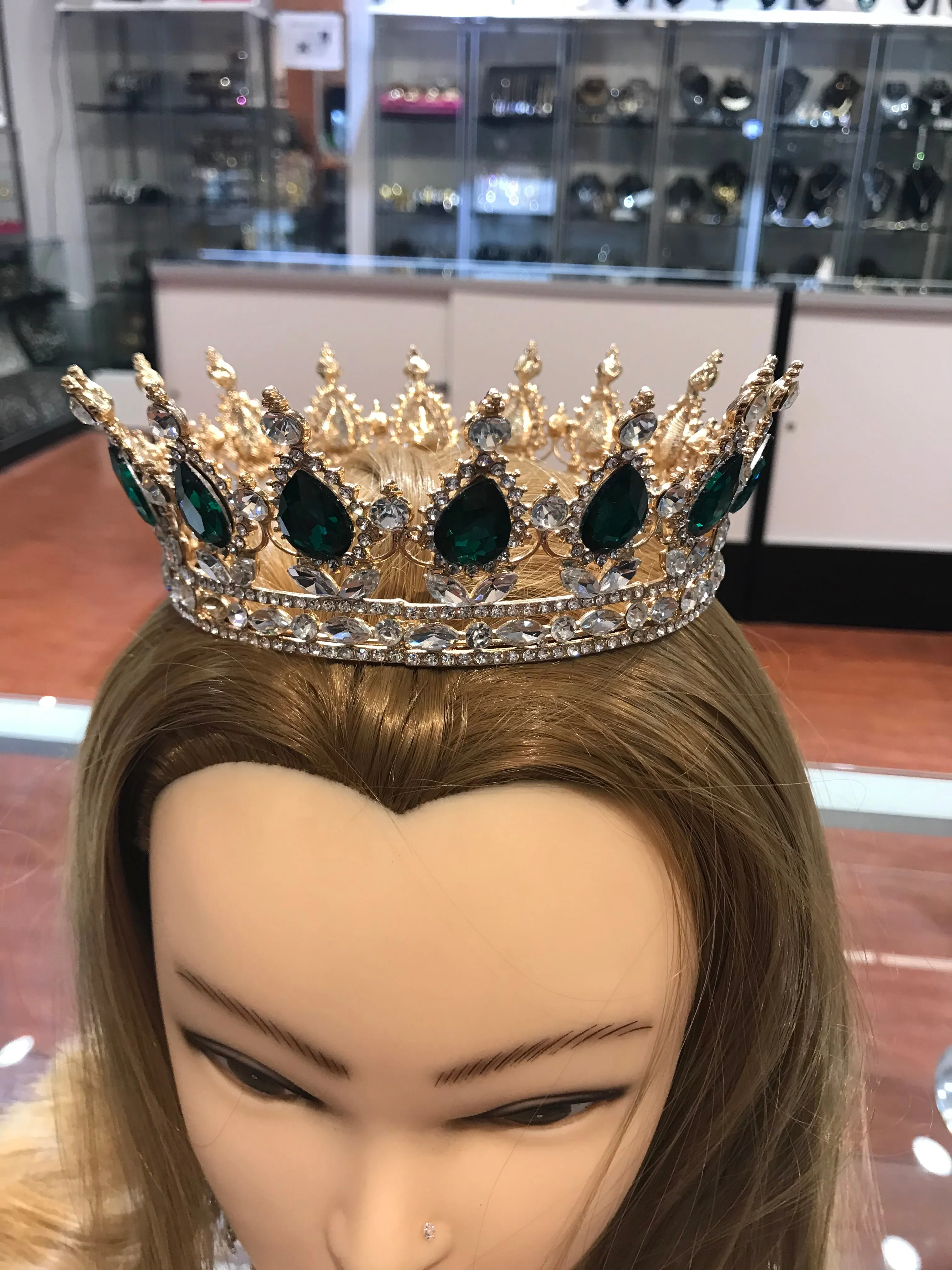 Crystalline Queen crown featuring green gemstone