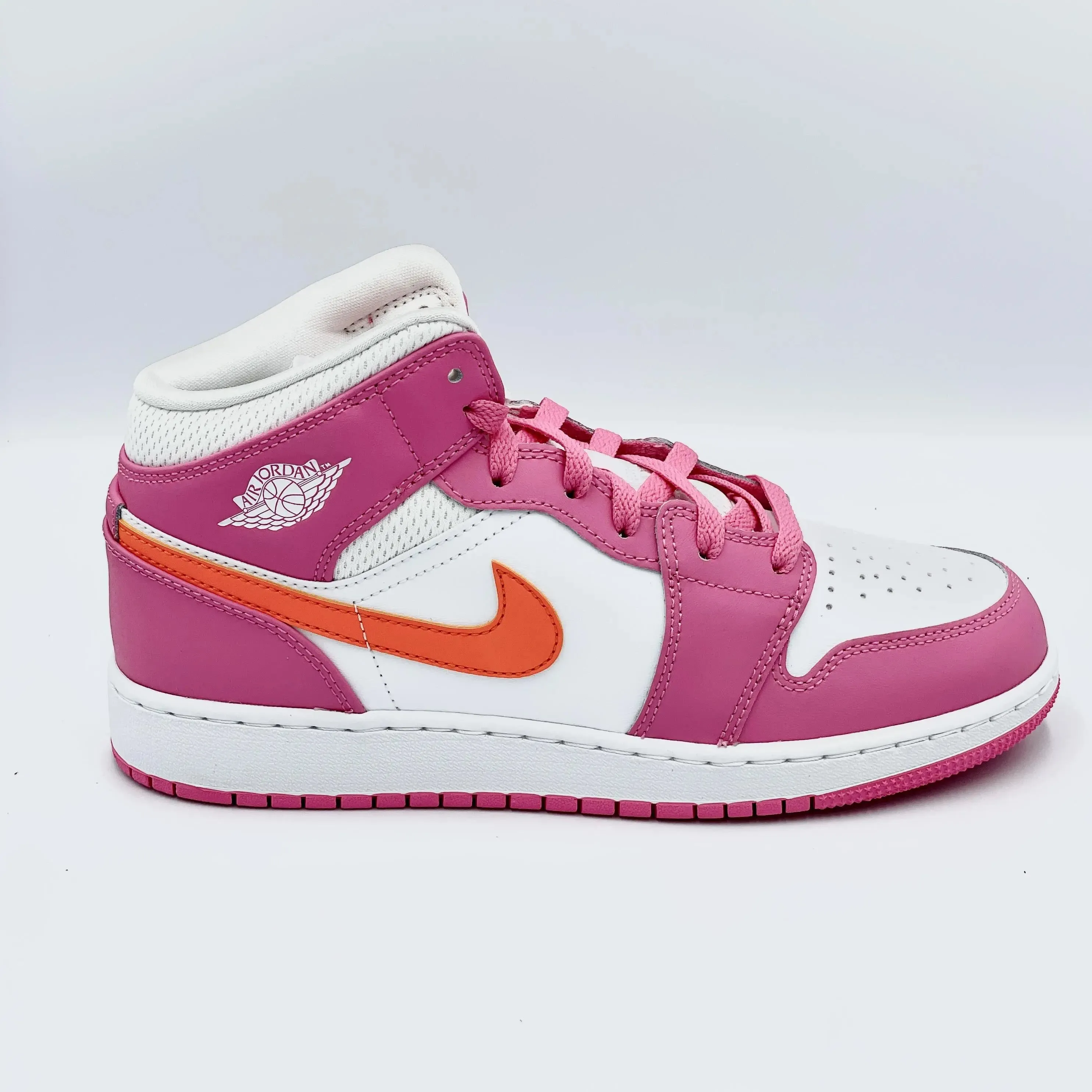 Jordan 1 Mid Pinksicle Safety Orange (GS) sneakers.