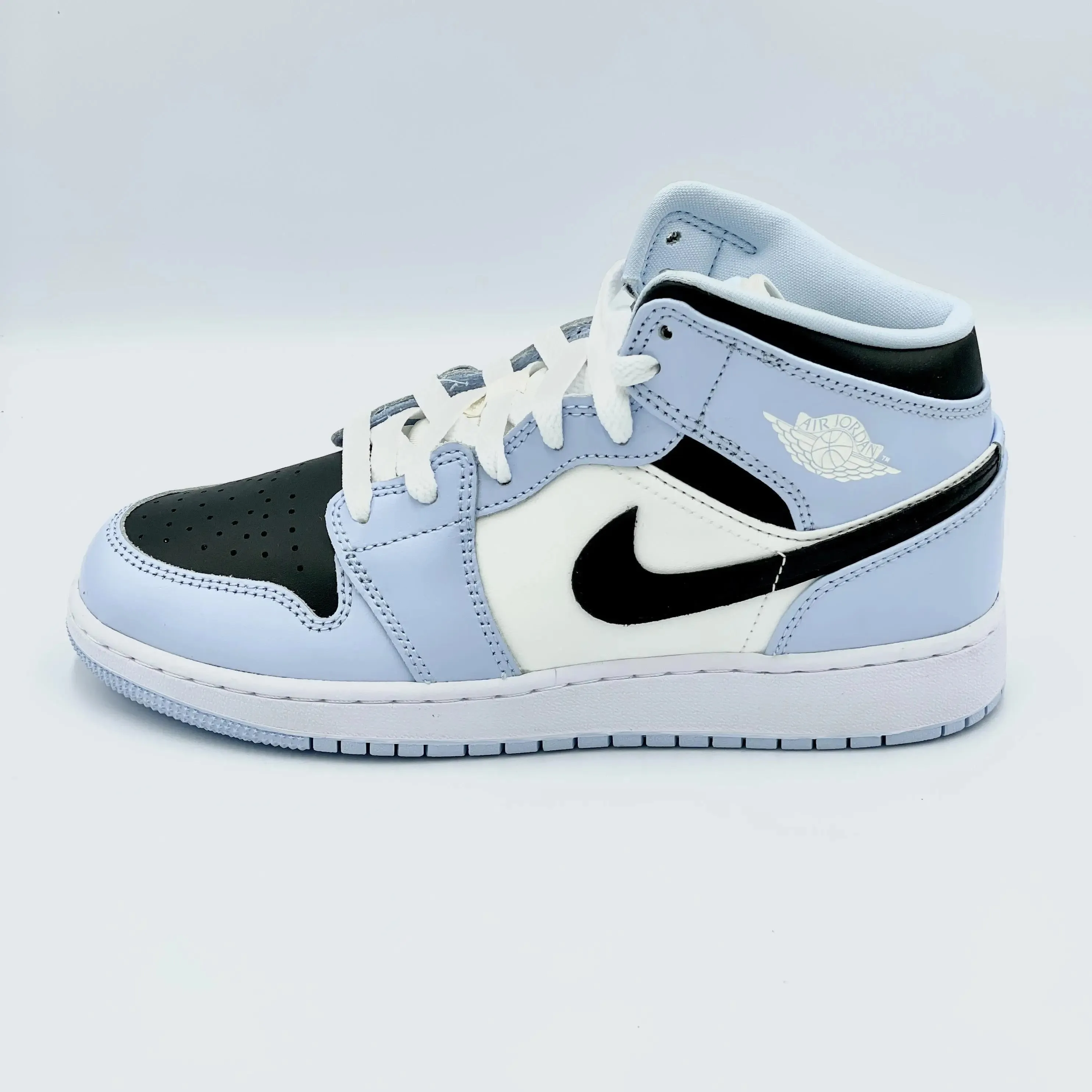 Jordan Mid Ice Blue sneakers.