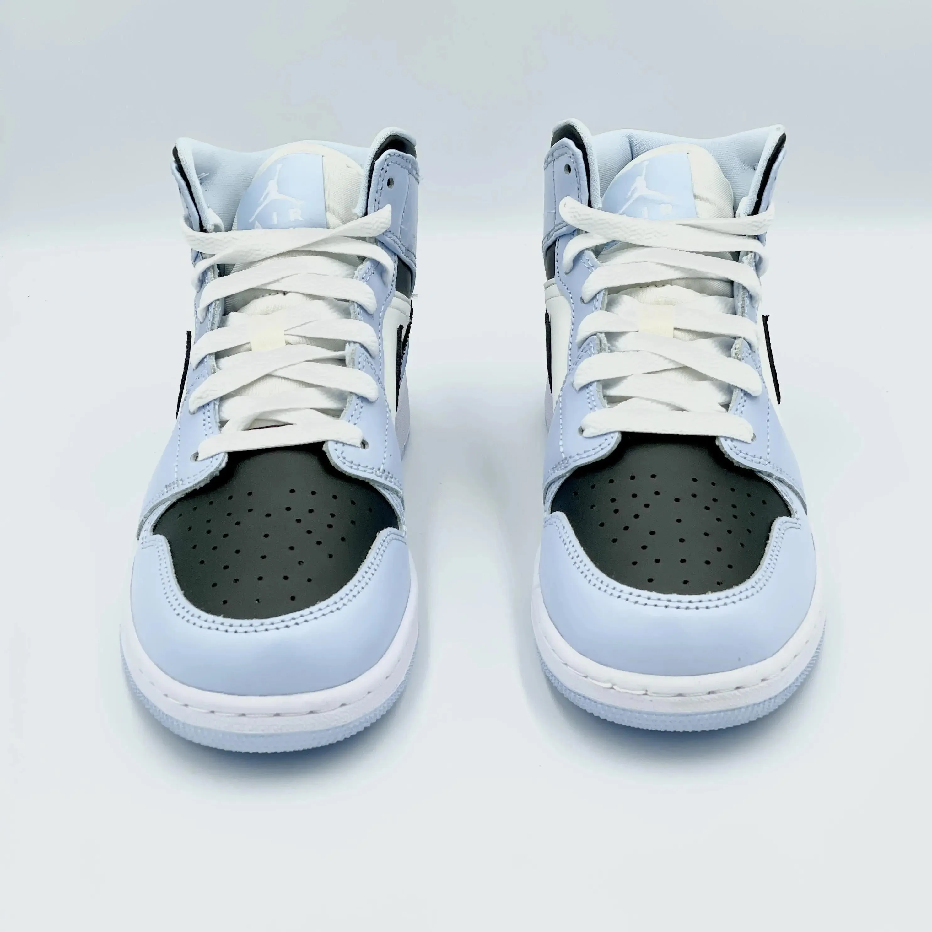 Jordan Mid Ice Blue sneakers.