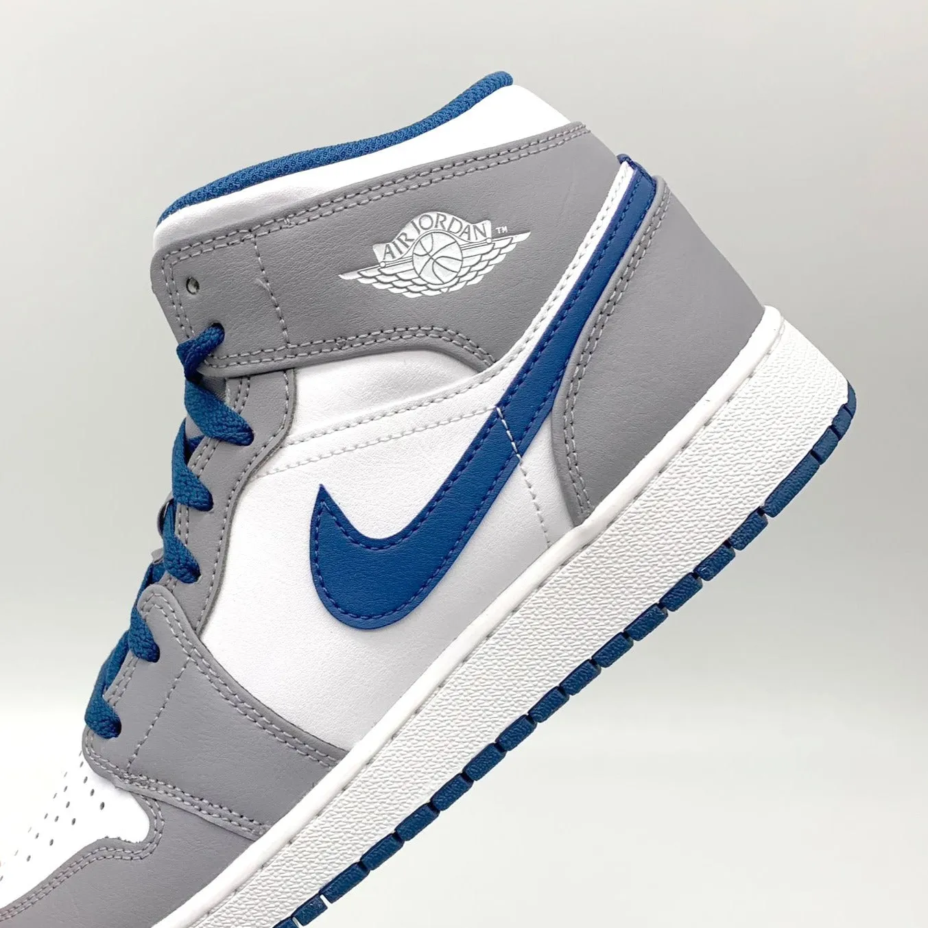 True Blue Cement Jordan 1 Mid sneakers