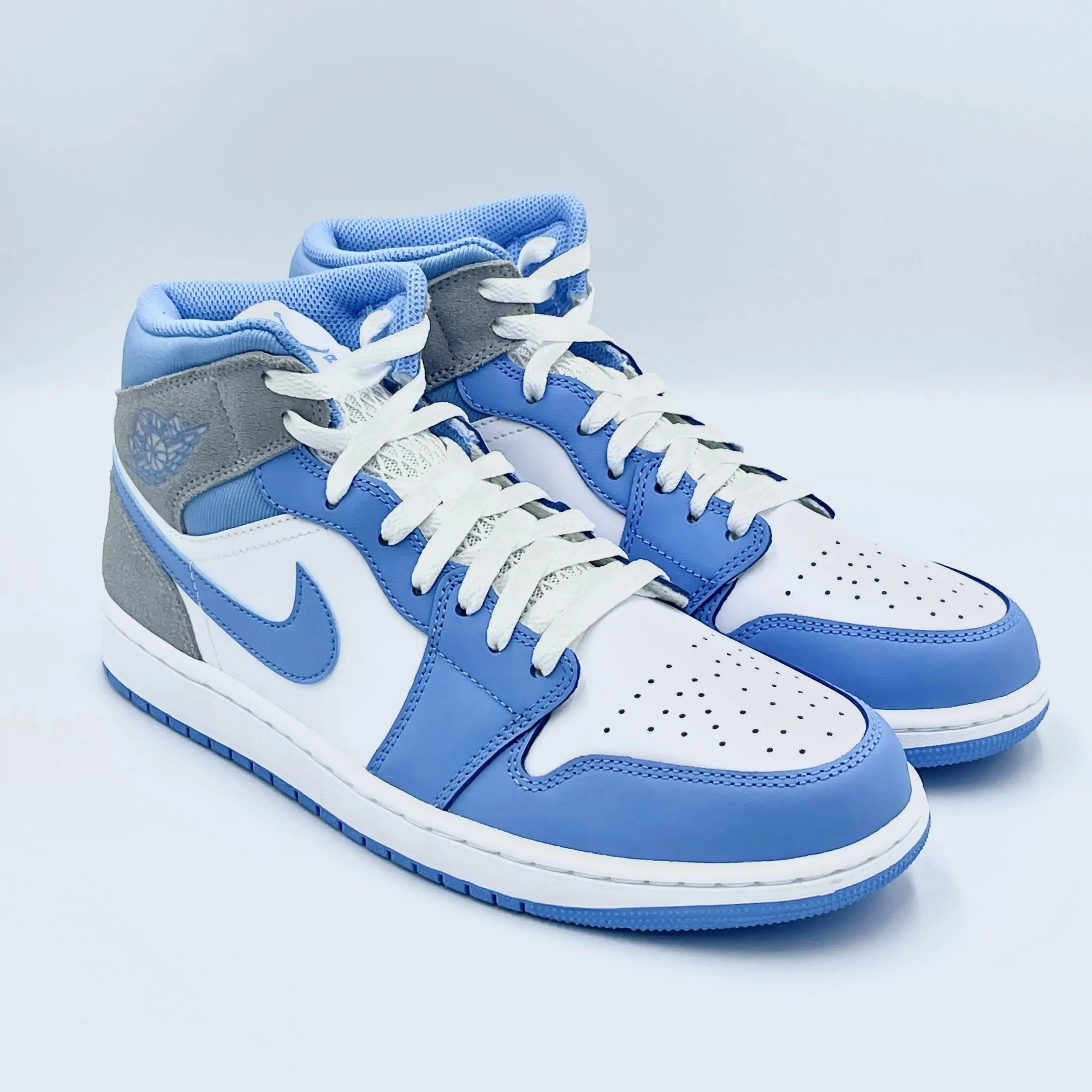 University Blue Grey Jordan 1 Mid