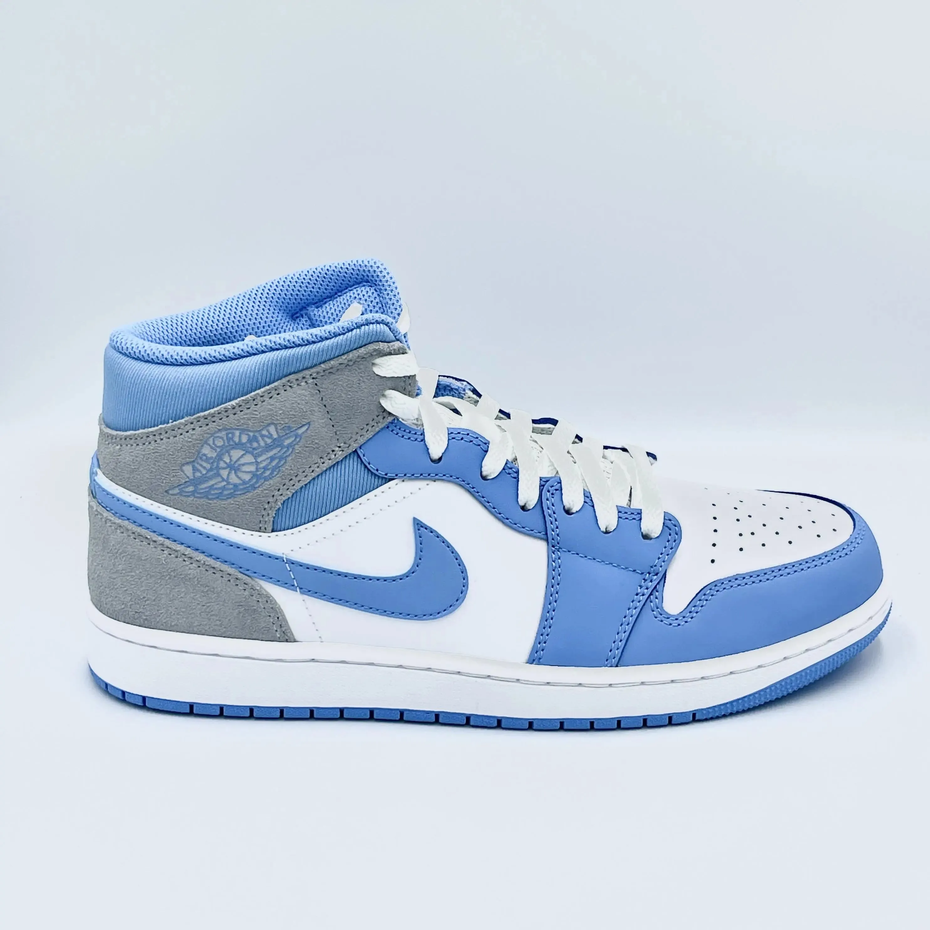 University Blue Grey Jordan 1 Mid